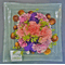 Flower arrangement on glass quality plate 30x30 with sea pebbles