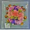 Flower arrangement on glass quality plate 30x30 with sea pebbles