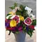 Rainbow color flowers in basket