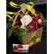 Flower arrangement with flowers in decorative hand paper bag.